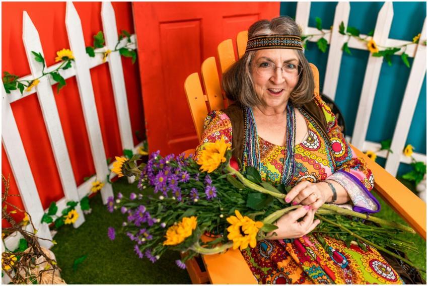 Senior woman with flowers enjoying outdoor garden