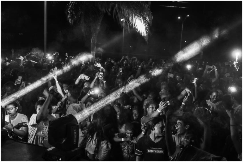 Energetic night concert scene with a diverse crowd