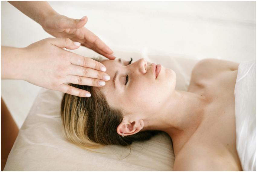 A woman enjoying a relaxing face massage at a spa