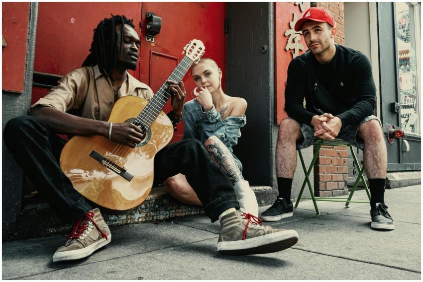 Diverse musicians perform on a city street, showca