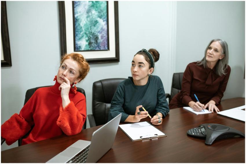 A group of women actively engaged in a collaborati