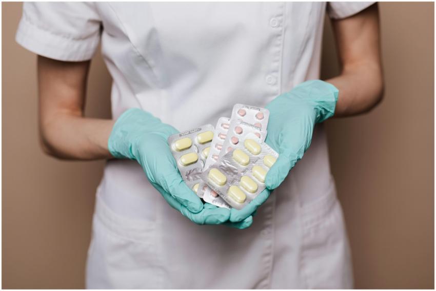 A healthcare professional in gloves and uniform ho