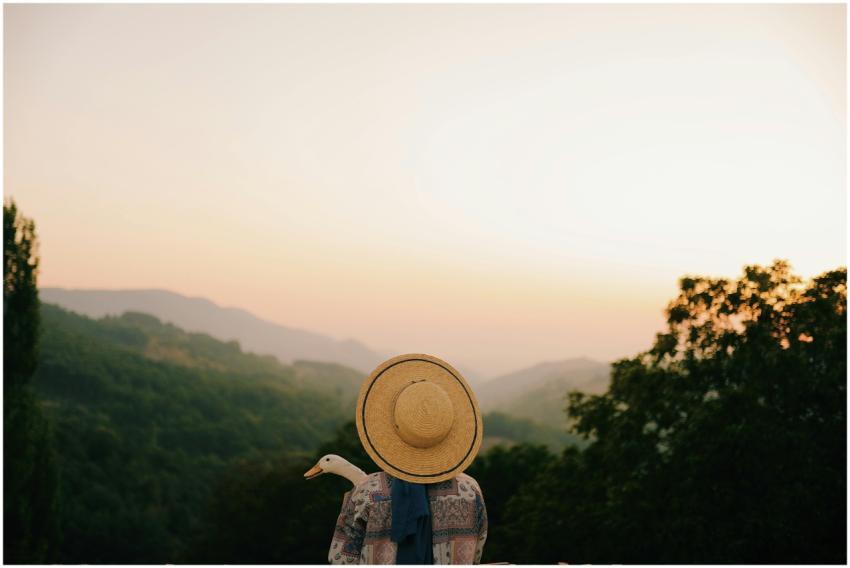 Back view of unrecognizable person in hat and casu