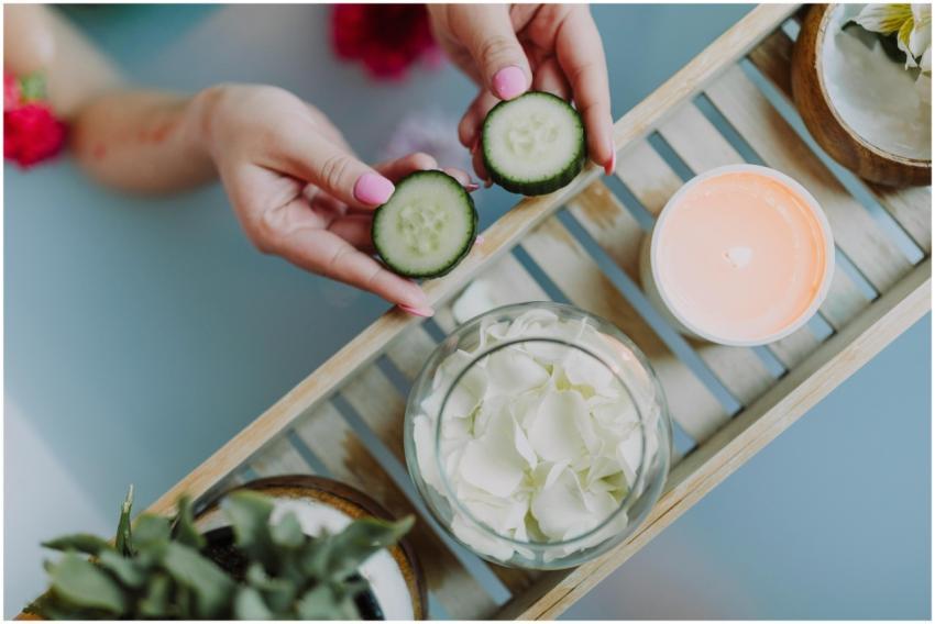 Top view of spa essentials including cucumber slic