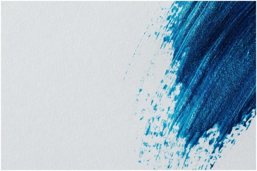 Abstract art with a bold blue brushstroke on a whi