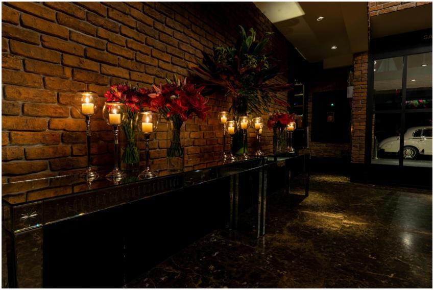 Elegant interior showcasing red brick walls, decor