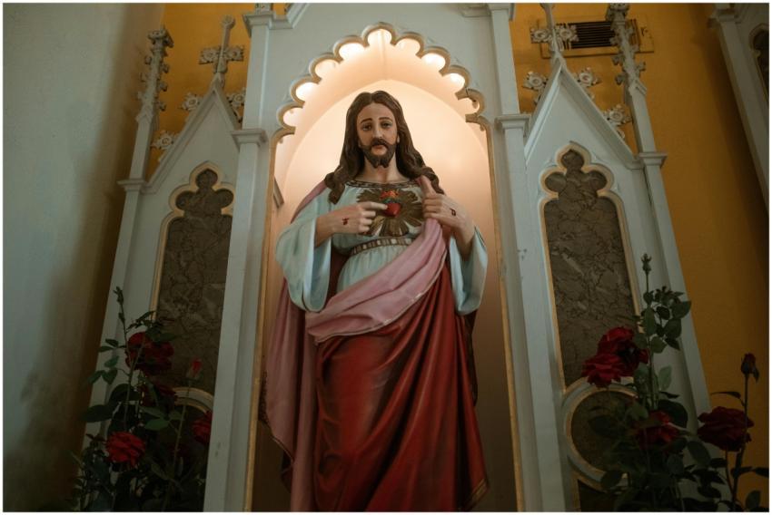 A religious statue of the Sacred Heart of Jesus wi