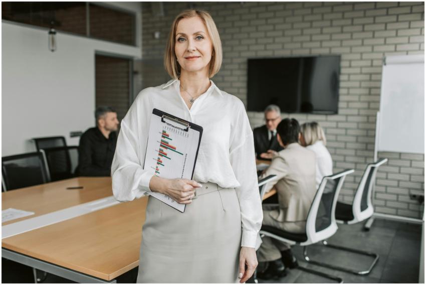 Professional businesswoman holding a clipboard dur