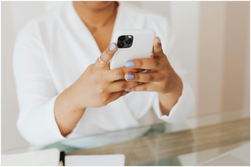 Close-up of a person holding a smartphone indoors