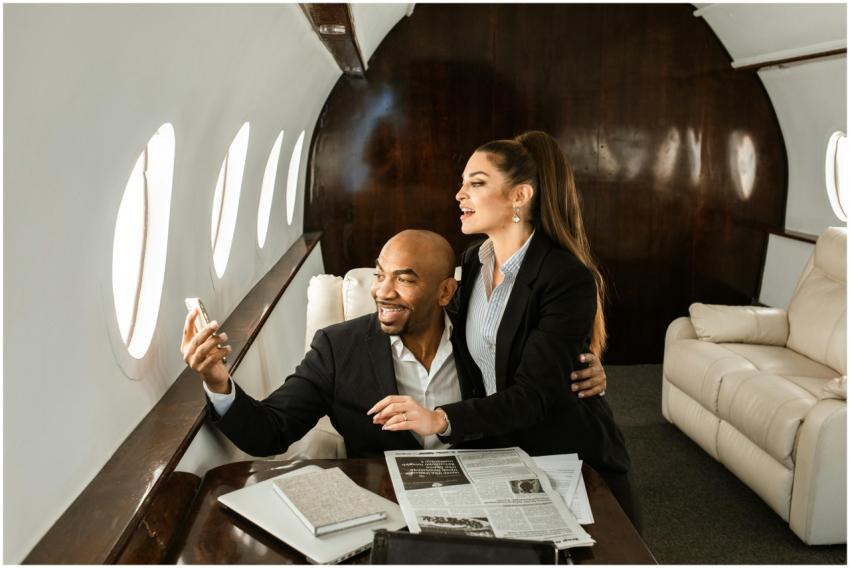 Professional couple enjoying business class comfor