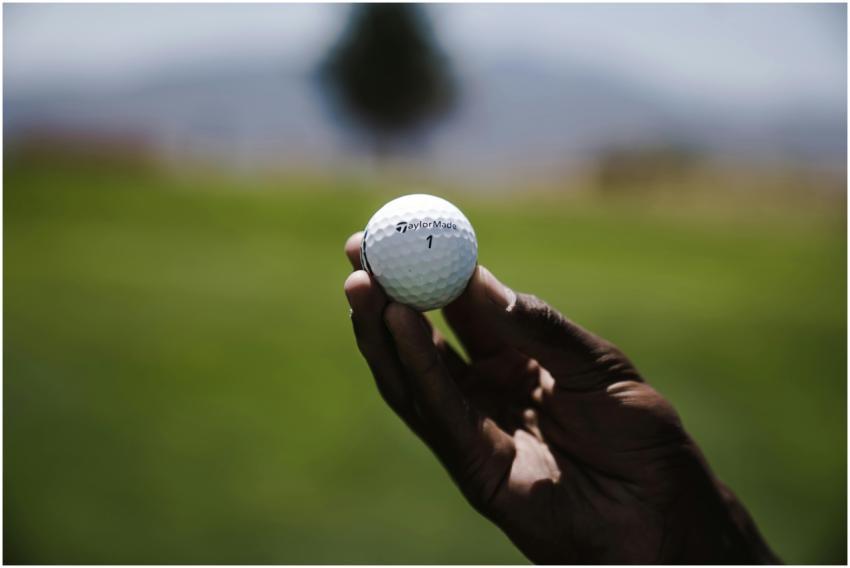 Detailed shot of a person holding a golf ball on a