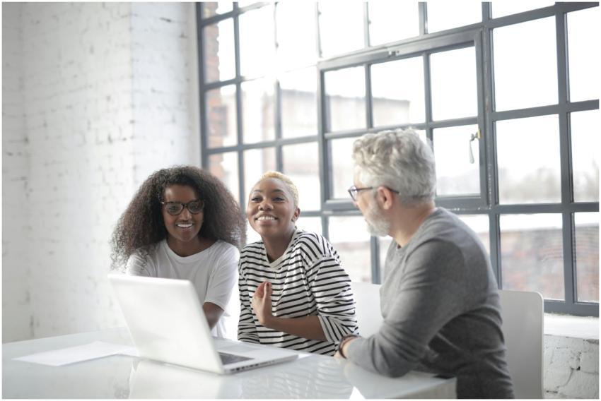 Positive multiracial colleagues wearing informal c