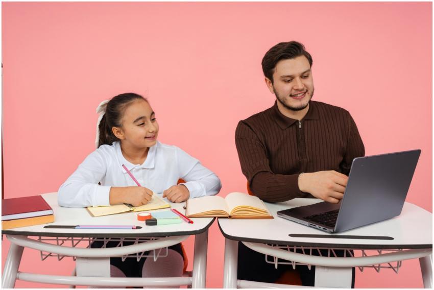A teacher guides a student in a classroom with boo
