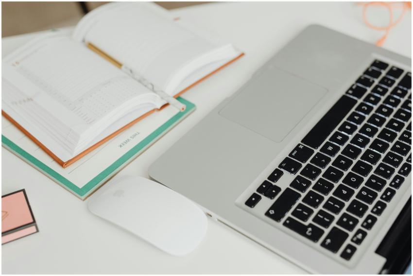 Overhead view of a modern workspace featuring an o
