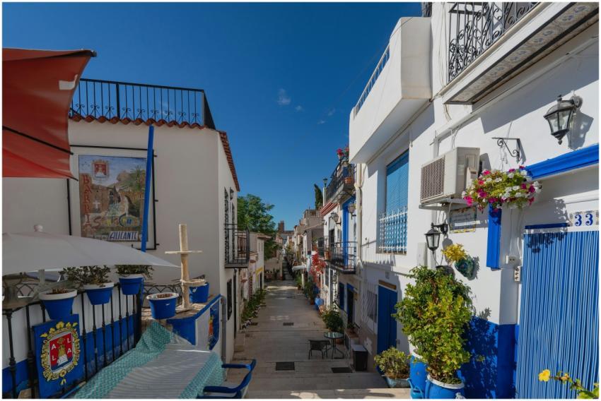 Picturesque narrow street in Alicante, Spain, with