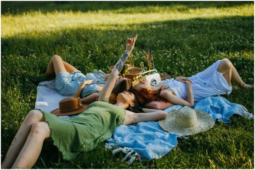 Group of women enjoying a relaxing picnic in a sun