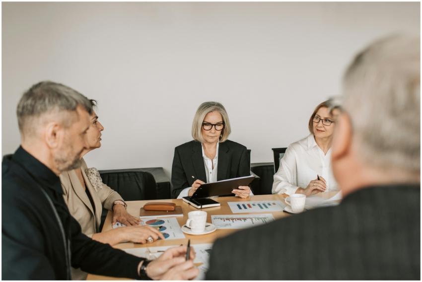 Senior professionals engaged in a collaborative bu