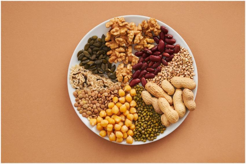 Top view of nuts, beans, and seeds on a plate, ide