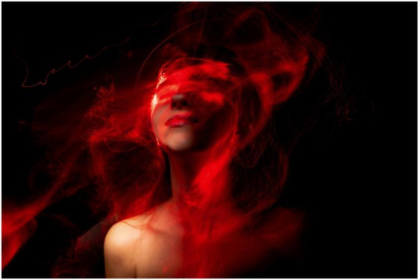 A creative abstract portrait featuring vibrant red