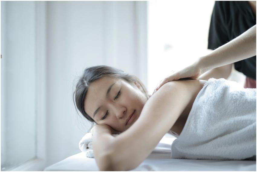 Asian woman enjoying a relaxing body massage at a