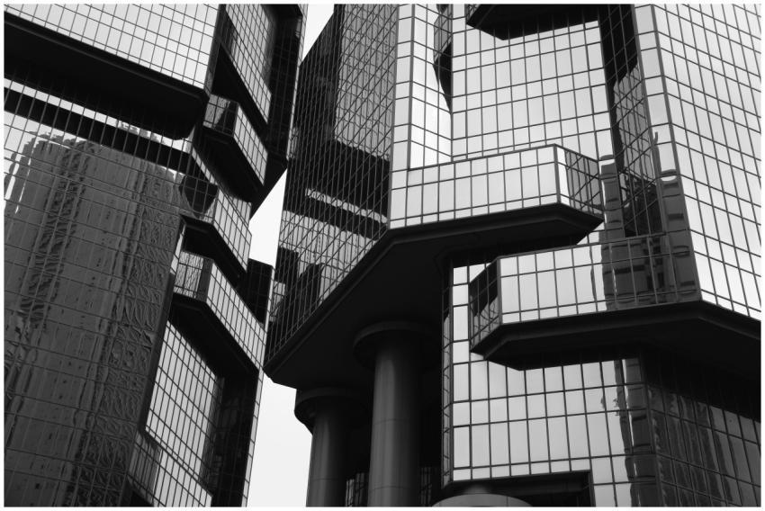 Black and white view of modern skyscraper with ref