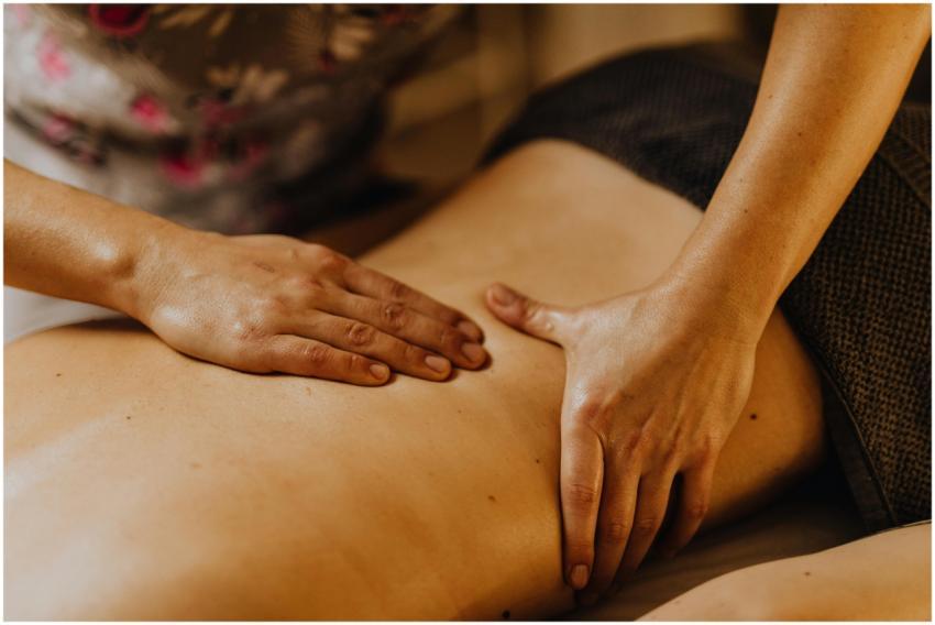 Close-up of hands giving a soothing back massage i
