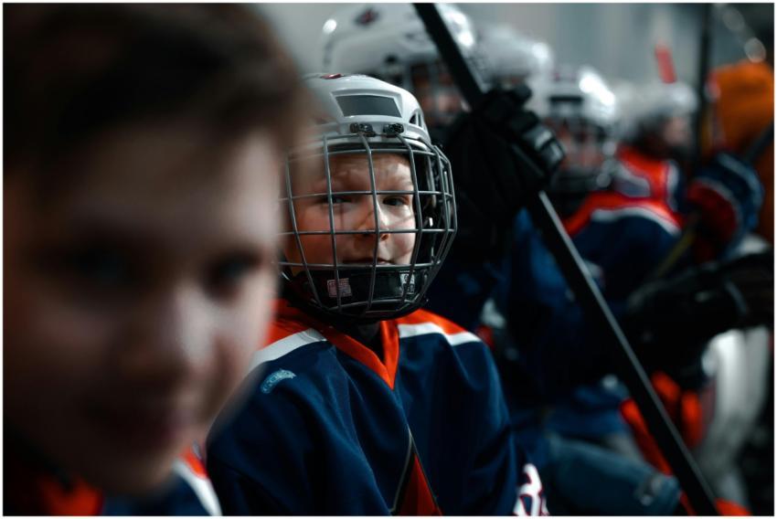 Young hockey players on the bench ready for action