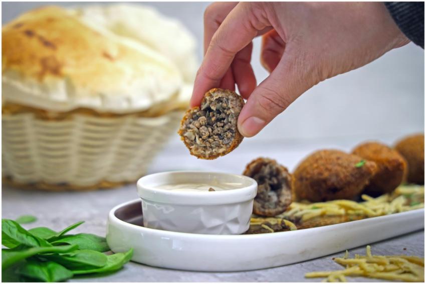 Delicious kibbeh and hot bread with creamy dip, pe