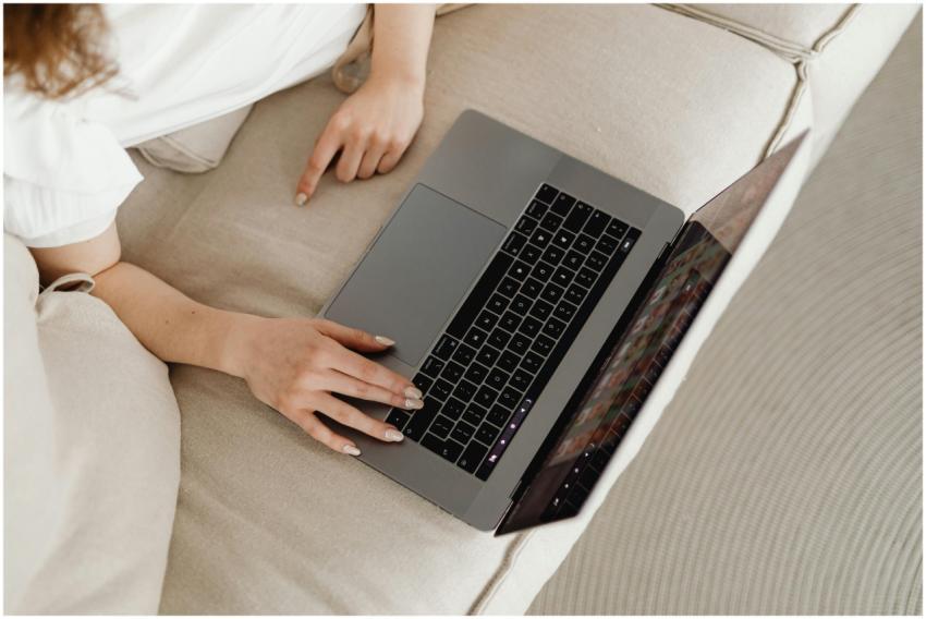 Close-up of a person working from home on a laptop