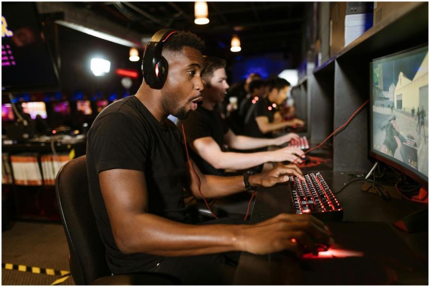 Group of gamers engaging in eSports on gaming comp