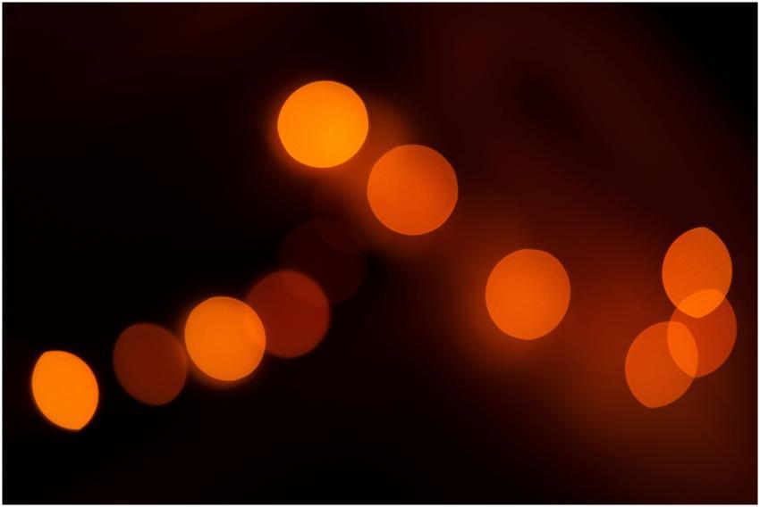 Dynamic abstract photo of orange bokeh lights crea