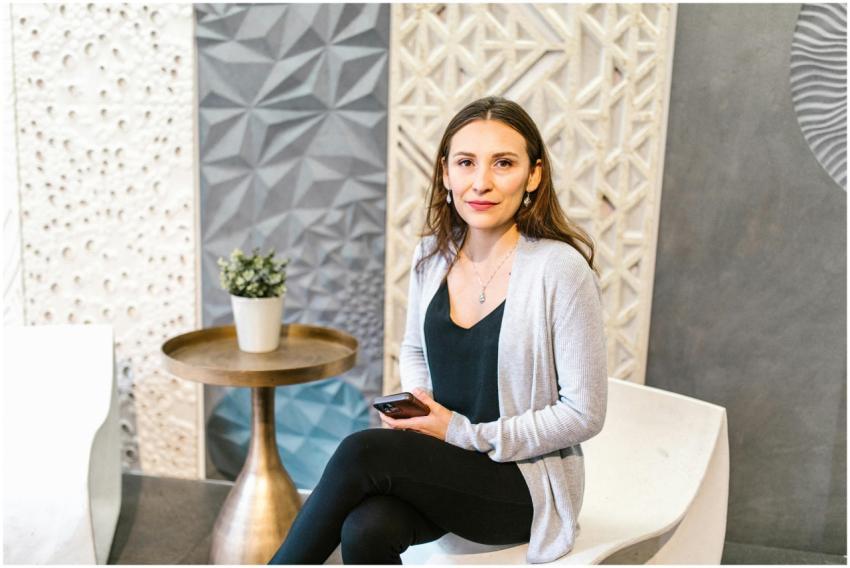 Young businesswoman in a modern office setting, ho