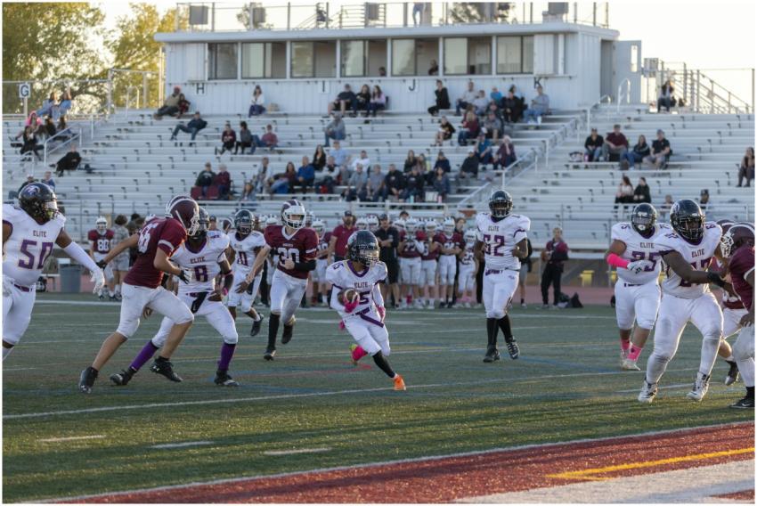 Exciting football match with young athletes in act