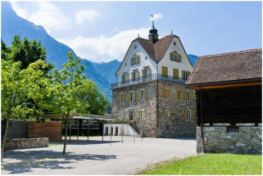 Charming Swiss building with a mountainous backdro