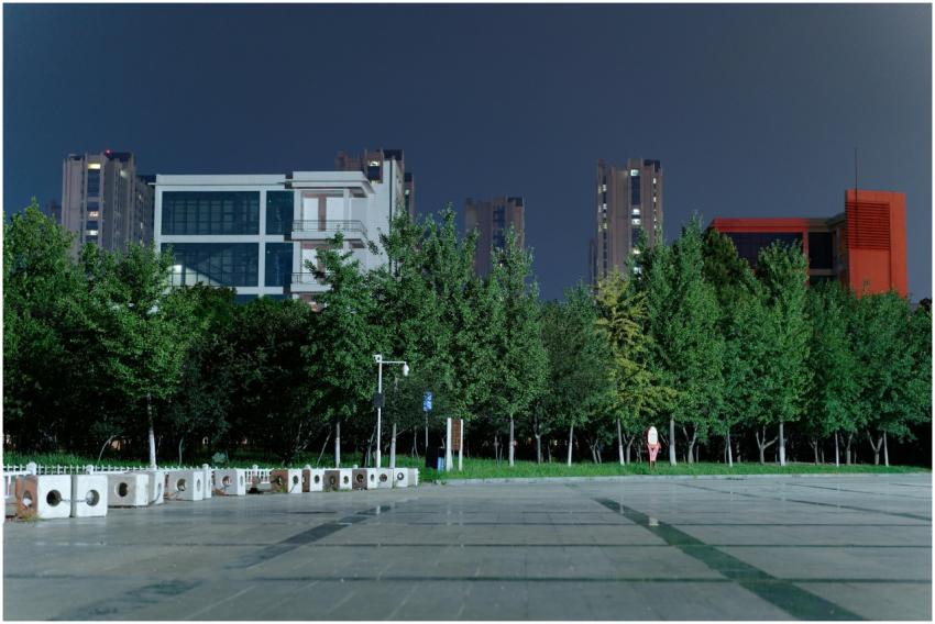 A tranquil night scene featuring urban buildings a