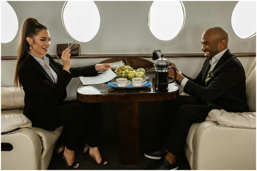 Professional meeting with coffee on a private jet,