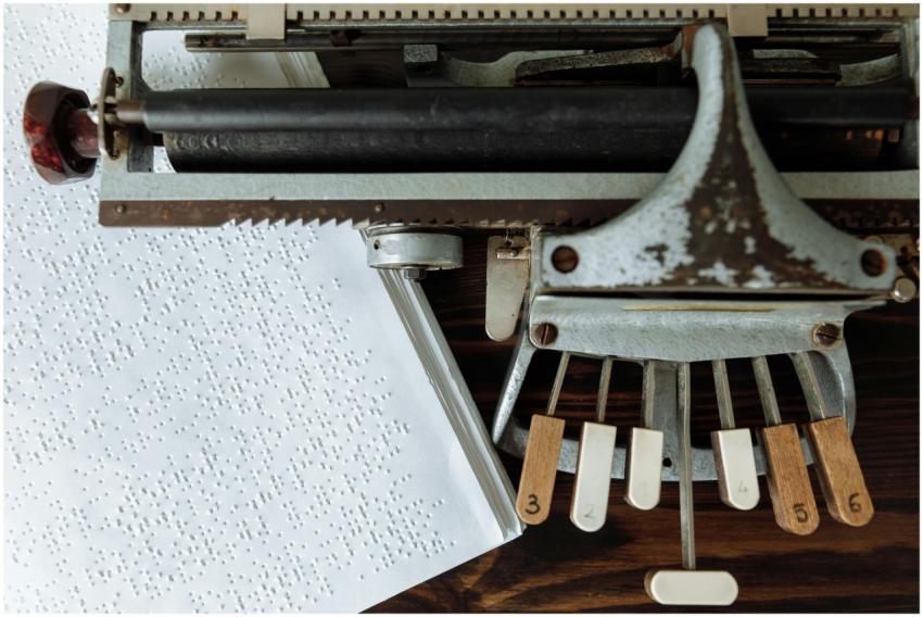 Close-up of a vintage Braille typewriter and Brail