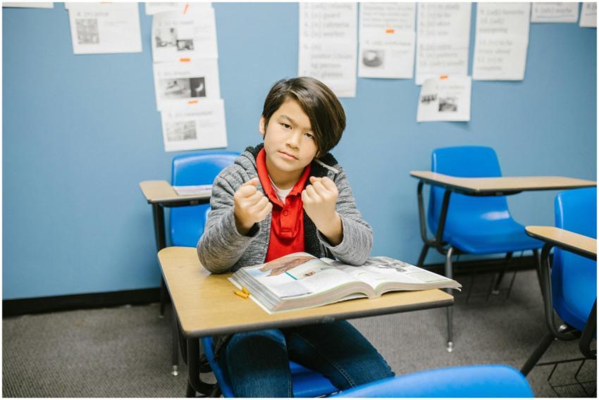 A young student with a determined expression sitti