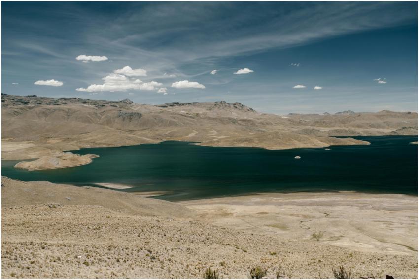 Scenic view of a tranquil lake amidst arid mountai