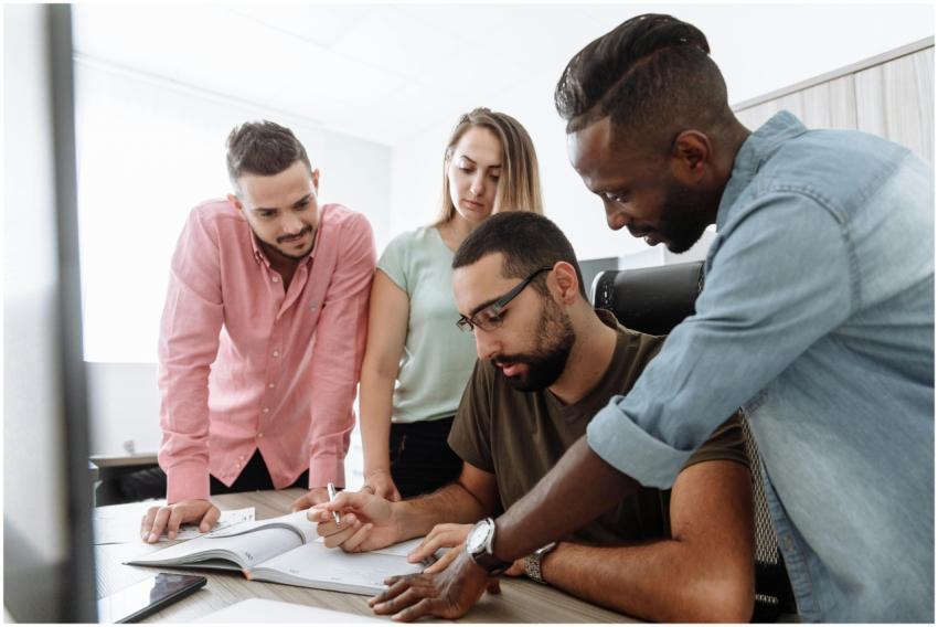 A group of diverse colleagues brainstorming and di