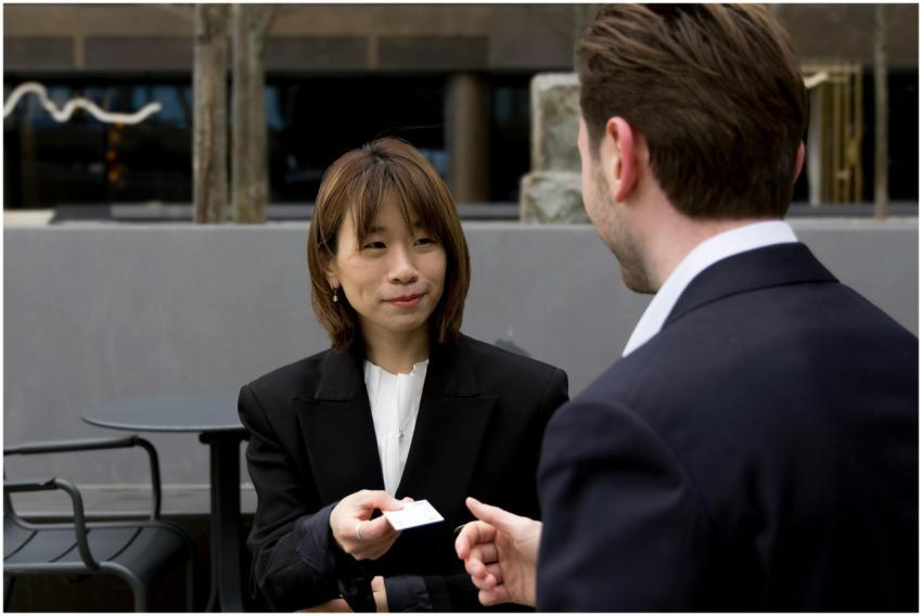 Two business professionals having a meeting outdoo
