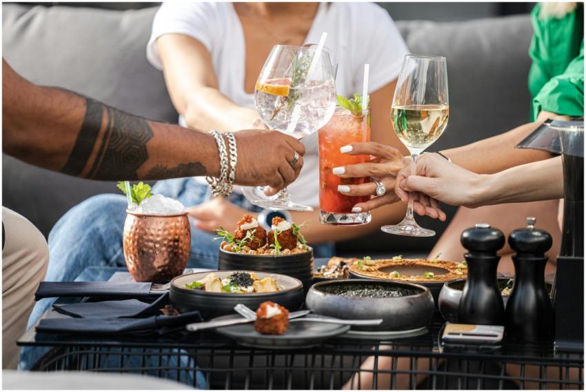 A group of friends enjoying cocktails and appetize
