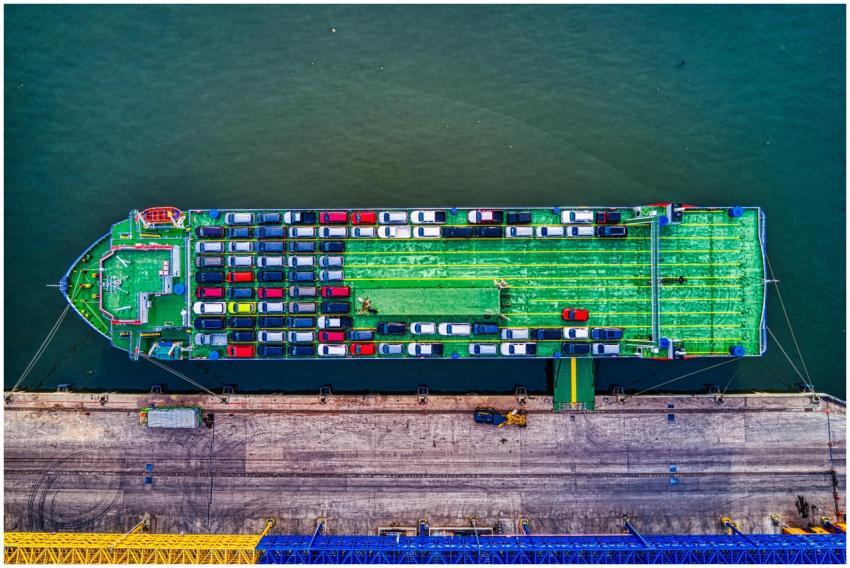 Aerial view of a car transport ship docked at Beka