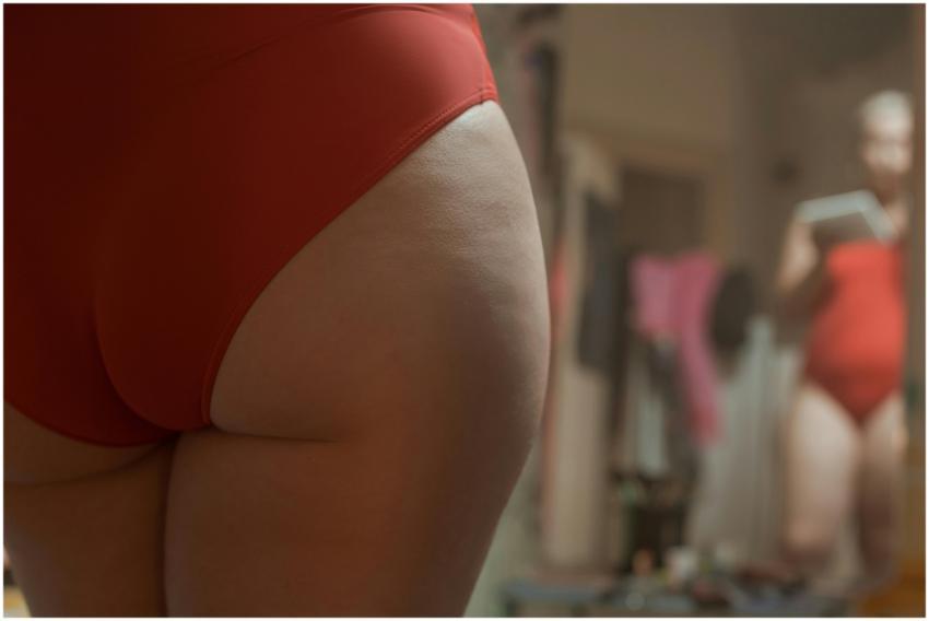 A close-up view of a person embracing body positiv