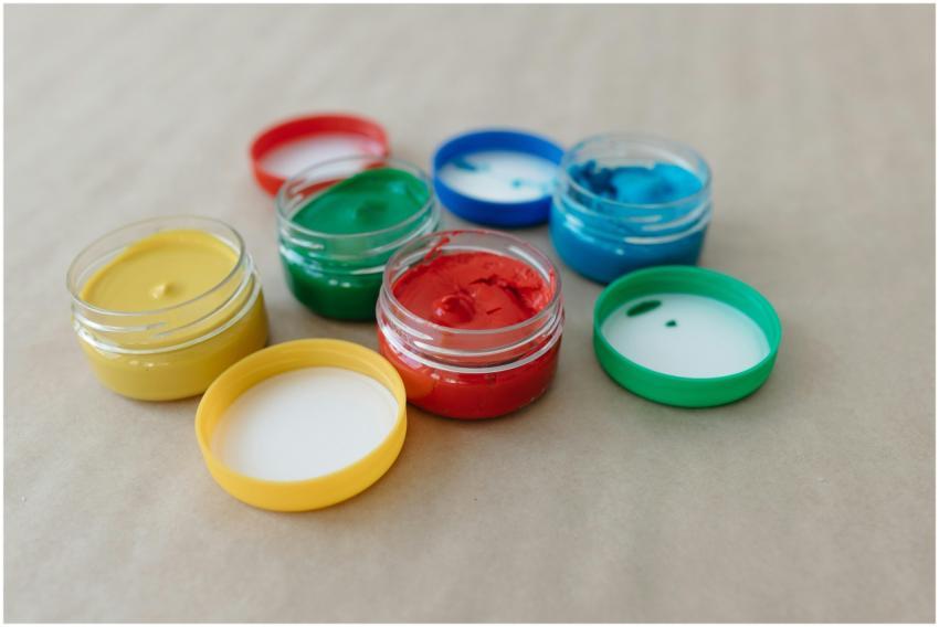 Vibrant paint jars with primary colors for art and
