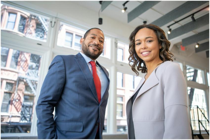 Business professionals smiling in a modern Detroit