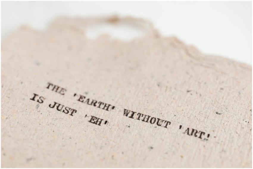 Close-up of a motivational art quote on a handmade