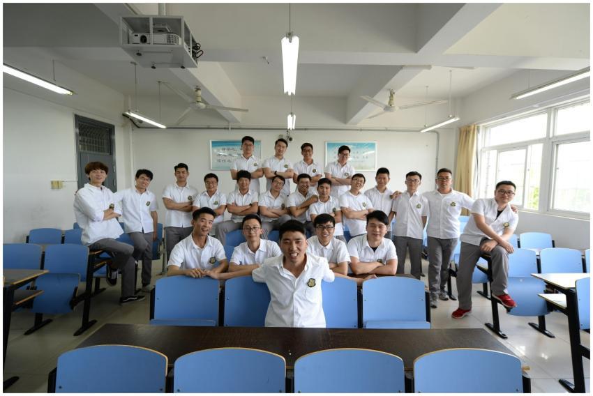 High school students in uniform posing cheerfully