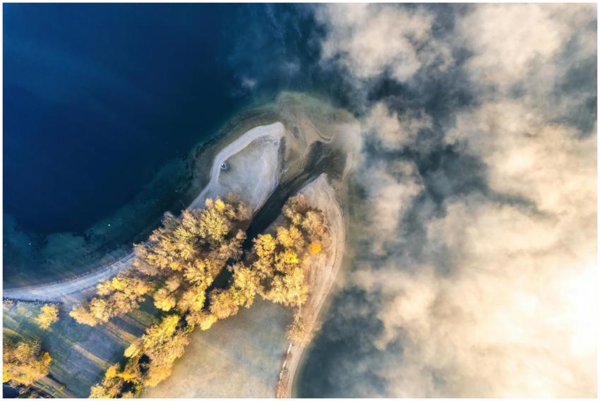 A stunning aerial view of a serene lake surrounded