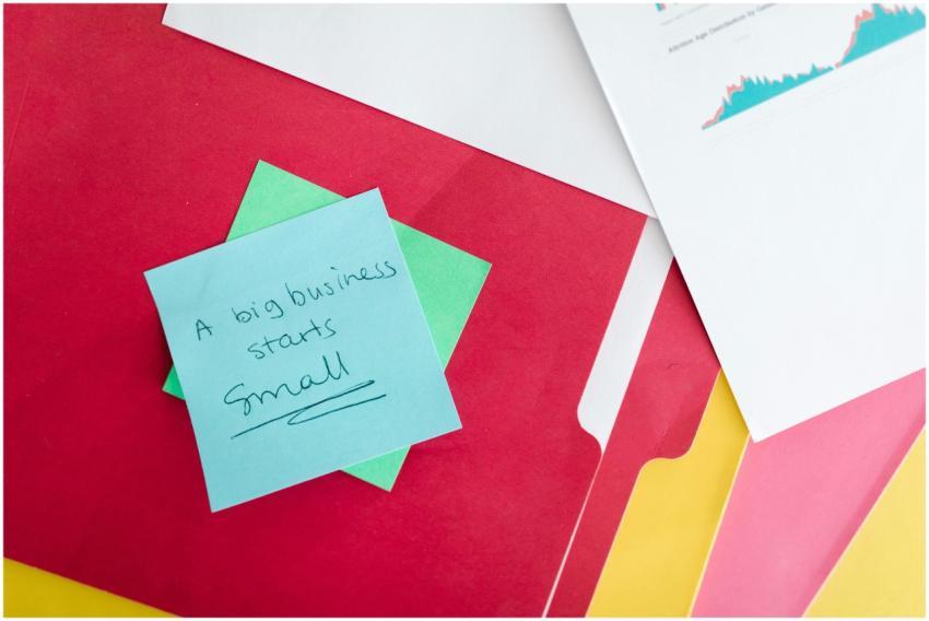 Colorful folders and a motivational business quote